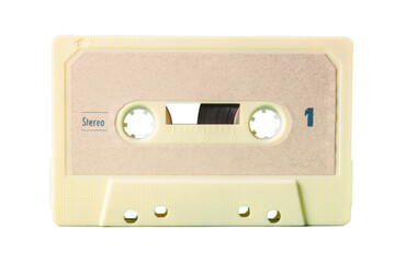 Isolated old vintage cassette tape from the 1980s (obsolete music technology). White cream plastic body, sand tone label.
