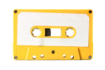 Isolated old vintage cassette tape from the 1980s (obsolete music technology). Electro yellow...