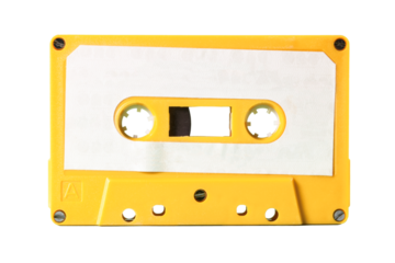 Isolated old vintage cassette tape from the 1980s (obsolete music technology). Electro yellow plastic body, white paper label.
