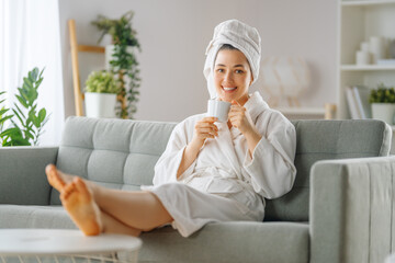 woman is relaxing after a bath - obrazy, fototapety, plakaty