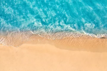 Küchenrückwand glas motiv Sonnenuntergang am Strand Summer seascape beautiful waves, blue sea water in sunny day. Top view from drone. Sea aerial view, amazing tropical nature background. Beautiful bright sea waves splashing and beach sand sunset light