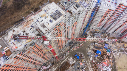 Top down view of house under construction with construction crane