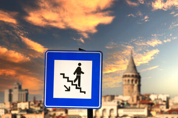 Obraz premium stair sign with galata tower in the background, traffic sign