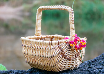 wicker decorative basket on a blurred background, decorated with red berries