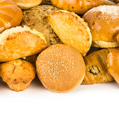 Bread and sweet pastry isolated on white .