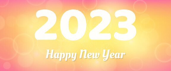 Happy new year 2023 incription on blurred background