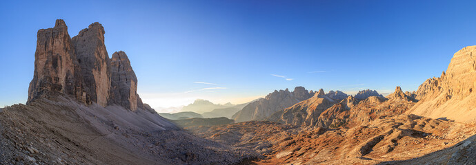 Panoramic view of Tre Cime Lavaredo and Torre dei Scarperi mountains before sunset
