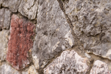 Stone wall. Uneven rough rock surface