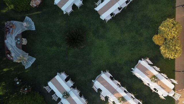 Beautiful wedding setup background ,Aerial drone shot of .
Wedding day event organization table setting decor. luxury event.