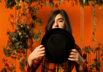 Obraz premium studio portrait of a girl in autumn decor
