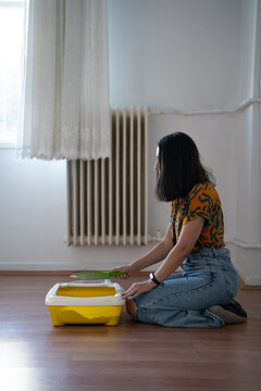 Girl Cleaning Nasty Cat Litter Box 