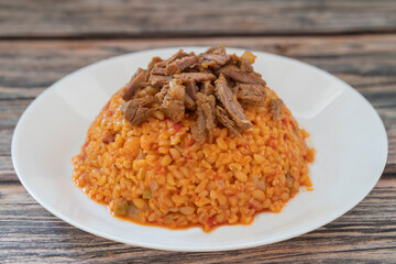 Traditional Turkish bulgur pilaf. Bulgur pilaf with lamb meat.