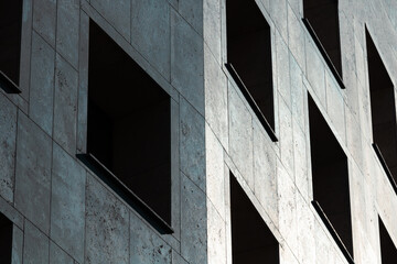 Facade of a modern building with dark windows