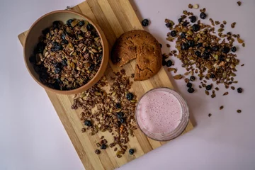 Meubelstickers Top view of a bowl of homemade nut and chocolate granola © Oksana Taran/Wirestock Creators