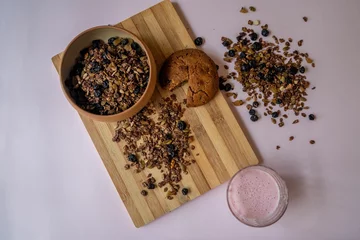 Foto op Canvas Top view of a bowl of homemade nut and chocolate granola © Oksana Taran/Wirestock Creators