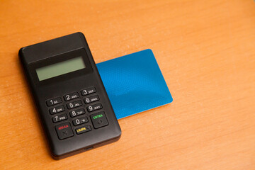 Inserting a card into a credit card machine. black machine. Credit card concept. Card machine concept.