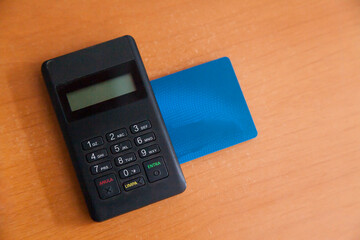 Inserting a card into a credit card machine. black machine. Credit card concept. Card machine...