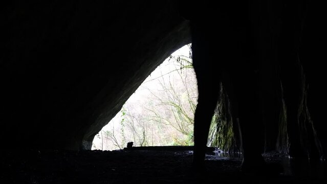 a caver walking in a cave