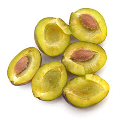 Plum halves with pits.