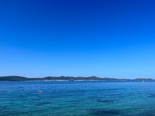 Fototapeta na wymiar Blue sea horizon, blue sky, natural colors, pure sea water surface
