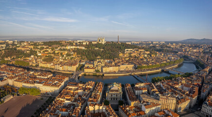 Obraz premium The drone panoramic view of The Basilica of Notre-Dame de Fourvière, Saone River and downtown district of Lyon, France. 