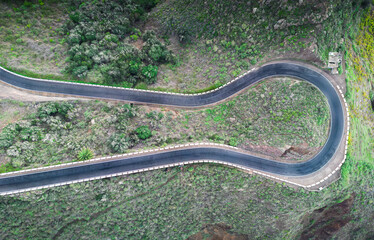 Aerial view of a winding road in the countryside without cars