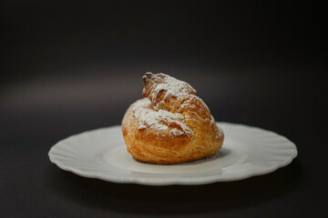 Eclair on a black background 2