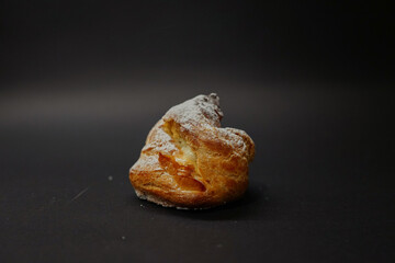 Eclair on a black background