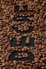 Inscription on decaffeinated coffee beans, top view of coffee.
