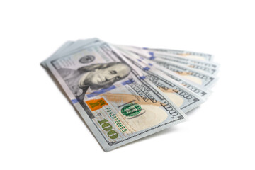 Pile of new design US dollar bills isolated on white background. Hundreds of dollar cash banknotes. Top view, flat lay. Business, finance, bank, currency, economy, wealth concept