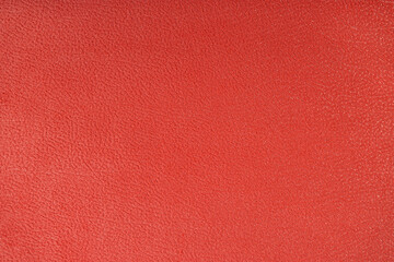 Texture background of velours red fabric. Fabric texture of upholstery furniture textile material, design interior, wall decor. Fabric texture close up, backdrop, wallpaper.