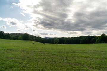 Hay bales and haystacks on the field during autumn. Slovakia