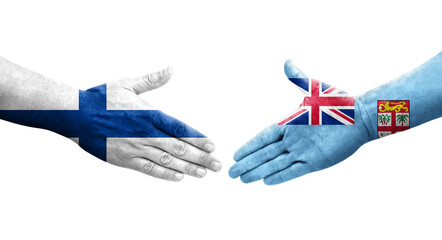 Handshake between Fiji and Finland flags painted on hands, isolated transparent image.