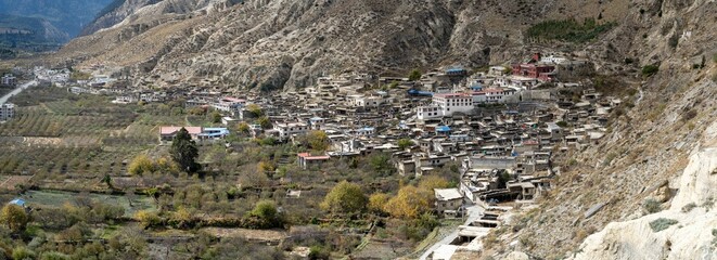 City on the mountainside with the mesmerizing landscape, Marpha in Mustang, Nepal, panorama