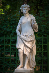 Fototapeta premium Marble statue of Roman Goddess Flora in Summer Garden, Saint Petersburg, Russia
