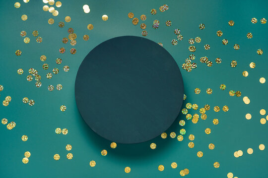 A Round Dark Teal On Blue Green Background With Golden Confetti. Scene To Show Cosmetic Products. Showcase, Display Case. Trendy Color 2023