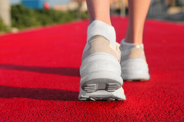 sports concept. legs close-up on a treadmill outdoors. active lifestyle. health
