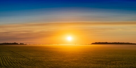 Landscape view of an orange-colored sunset over the prairies - obrazy, fototapety, plakaty