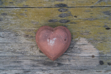 stone hearts on wooden background