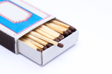 Match box full of matches close up on white background
