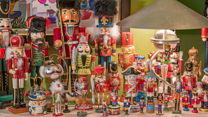 A nutcracker collection is displayed on a table for Christmas. 