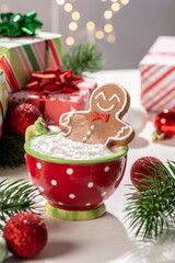 Gingerbread cookie man with a hot chocolate for Christmas. Traditional holiday symbol. Christmas...