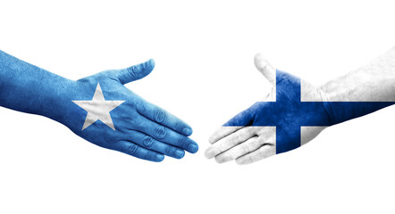 Handshake between Finland and Somalia flags painted on hands, isolated transparent image.