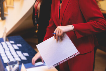 Process of checking in on a conference congress forum event, registration desk table, visitors and...
