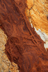 Natural rock texture of a colorful rock formations in silence beach (playa del Silencio) in Asturias, north of Spain.