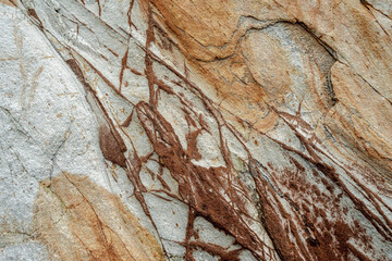 Natural rock texture of a colorful rock formations in silence beach (playa del Silencio) in Asturias, north of Spain.