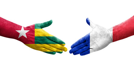 Handshake between France and Togo flags painted on hands, isolated transparent image.