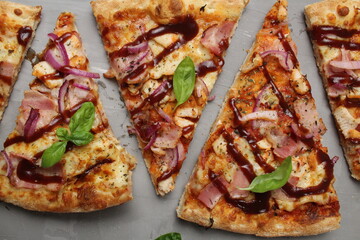 background of pizza food close-up pizza with chicken and dark sauce and basil. Vertical horizontal background of pizza slices. Pizza Day