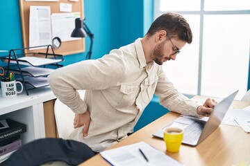 Young caucasian man business worker suffering for backache at office