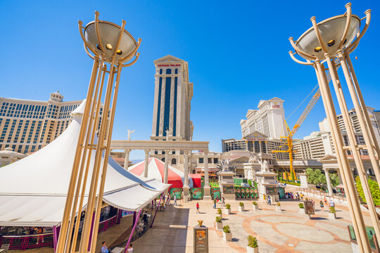 Caesars Palace and Bellagio Hotel and Casino in Las Vegas Strip. Street view, architecture, people, sunny day with cler blue sky background